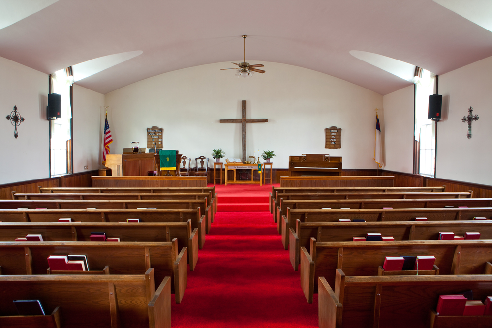 This  photo shows the interior of a small country church.